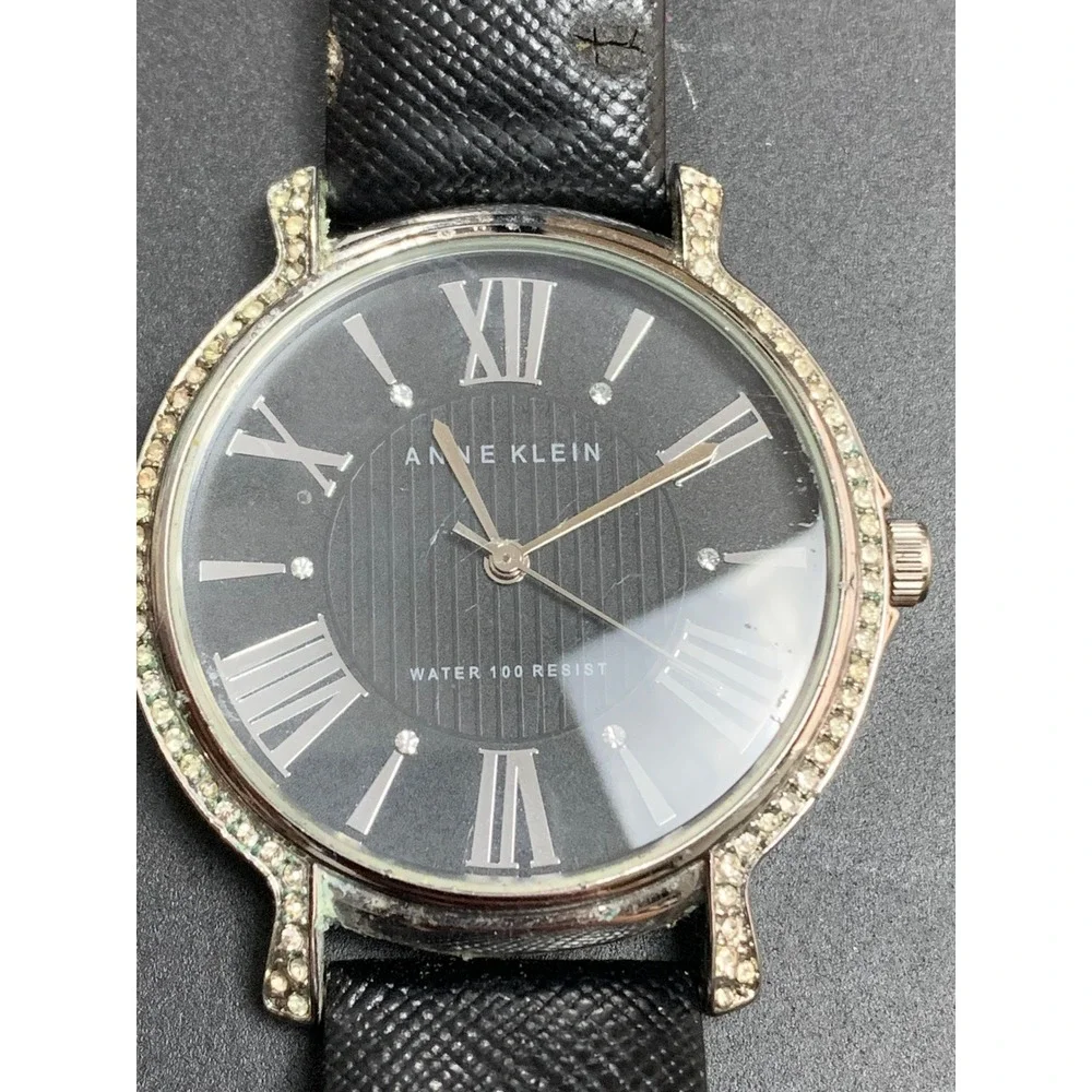 Anne Klein AK/1155 Crystal Bezel Black Dial Leather Strap Watch Womens